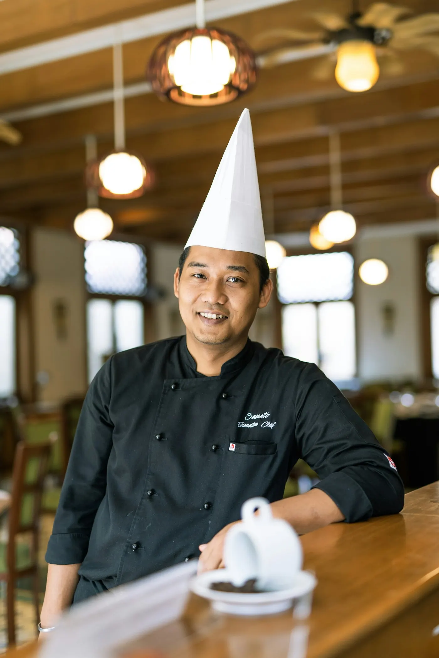 Chef inspecting dishes in a commercial kitchen